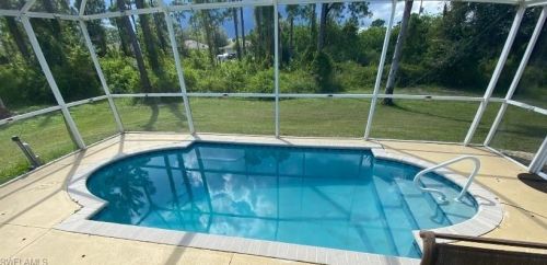 518 Aspen Ave, Lehigh Acres FL 33974-9613 exterior