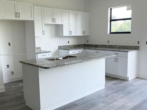 546 Aspen Ave, Lehigh Acres FL 33974-9613 exterior