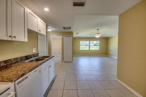 217 Ivan Ave, Lehigh Acres FL 33973-2011 exterior