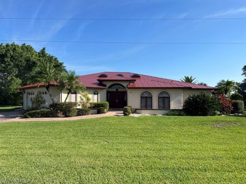 725 Mirror Lakes Dr, Lehigh Acres, FL 33974-9780