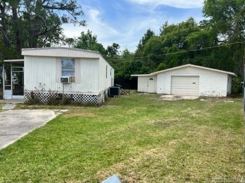 129 West Loop, Oak Hill, FL 32759-9549