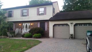 11 Longfellow Ter, Morganville, NJ 07751-1410