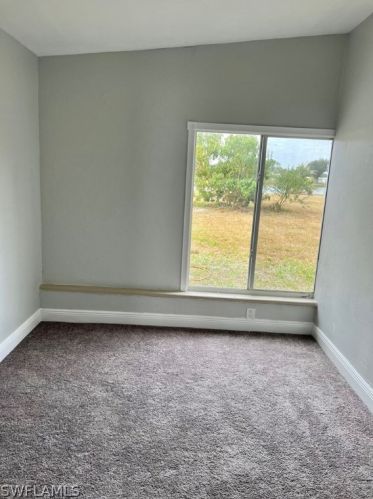 21 Lincoln Ave, Lehigh Acres FL 33936-1454 exterior