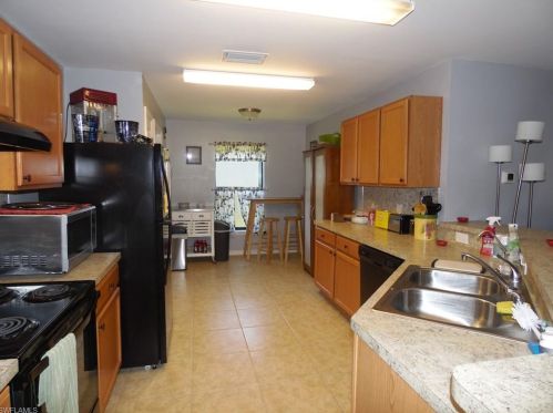 213 Shadow Lakes Dr, Lehigh Acres FL  33974-0806 exterior