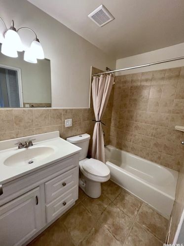 63 Storm Dr, Holtsville NY  11742-1909 exterior