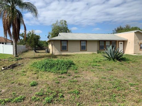 917 Rita Ave, Lehigh Acres, FL 33971-5203
