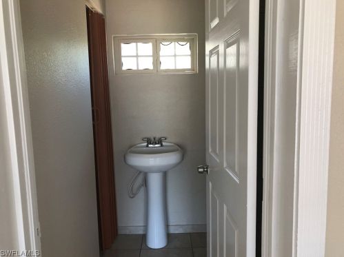 302 Arthur Ave, Lehigh Acres FL  33936-7410 exterior