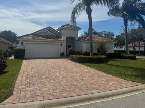 1595 Whispering Oaks Cir, Naples, FL 34110-4140