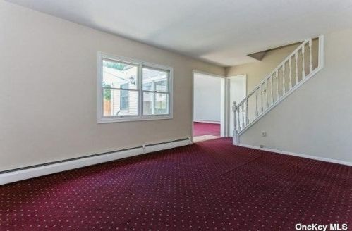 11 Lotus Ln, Westbury NY  11590-6320 exterior