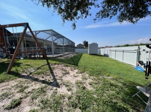 1041 Cedartree Ave, Lehigh Acres FL 33971-7590 exterior