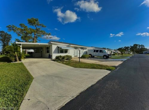 18 Dawn Flower Cir, Lehigh Acres FL 33936-7355 exterior