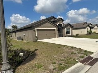 427 Shadow Lakes Dr, Lehigh Acres FL  33974-0827 exterior
