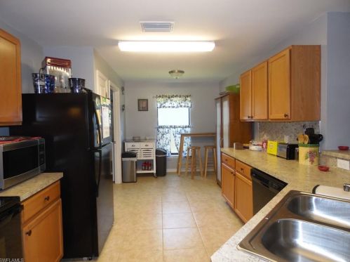 213 Shadow Lakes Dr, Lehigh Acres FL  33974-0806 exterior