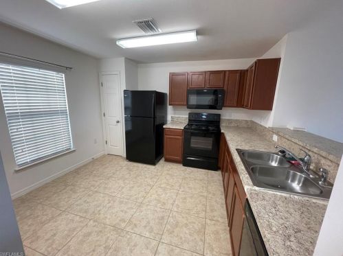 128 Shadow Lakes Dr, Lehigh Acres, FL 33974-0803