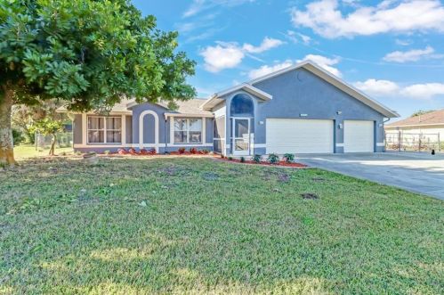 221 Schoolside Dr, Lehigh Acres, FL 33936-5056
