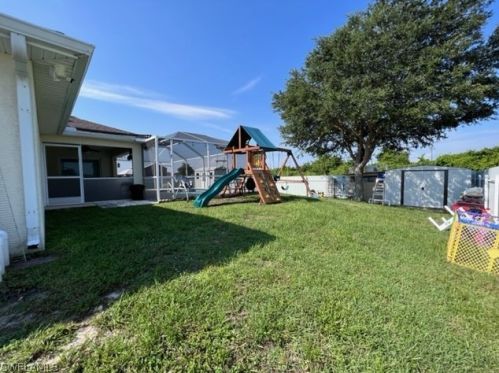 1041 Cedartree Ave, Lehigh Acres FL 33971-7590 exterior