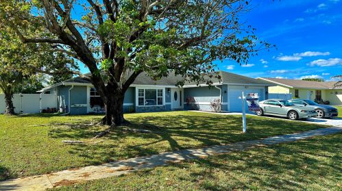 126 La Mancha Ave, West Palm Beach FL  33411-1345 exterior