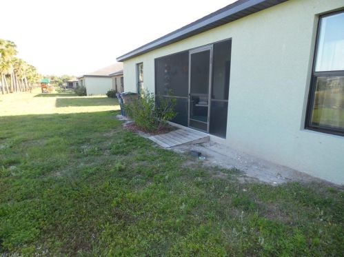 213 Shadow Lakes Dr, Lehigh Acres FL  33974-0806 exterior