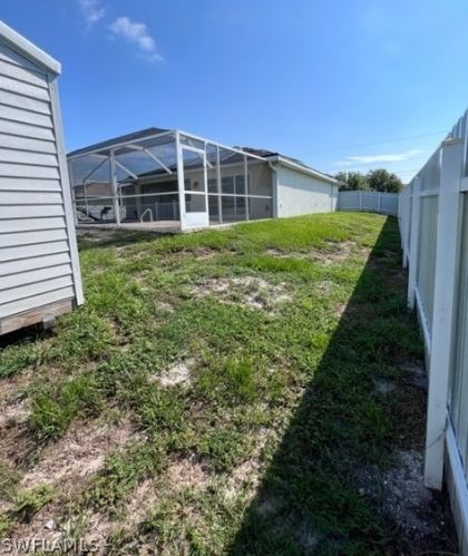 1041 Cedartree Ave, Lehigh Acres FL 33971-7590 exterior