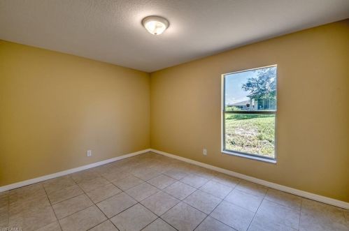 217 Ivan Ave, Lehigh Acres FL 33973-2011 exterior