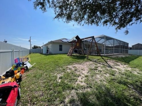 1041 Cedartree Ave, Lehigh Acres FL 33971-7590 exterior