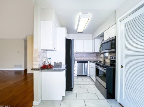 279 Rosewood Ct, Lehigh Acres FL  33936-1448 exterior