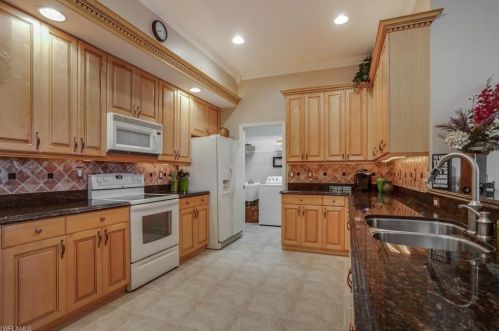 600 Aston Lake Ct, Lehigh Acres, FL 33974-9563