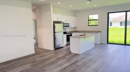 546 Aspen Ave, Lehigh Acres FL 33974-9613 exterior