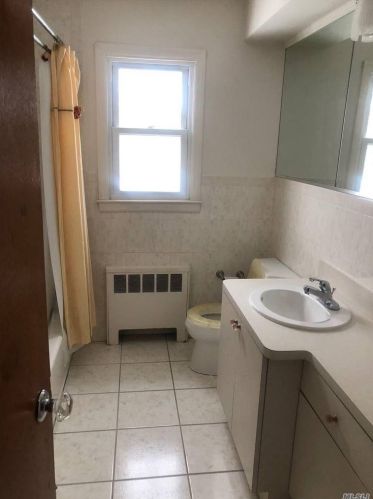 256 Pennywood Ave, Roosevelt NY  11575-1236 exterior