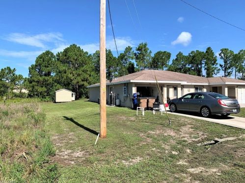 712 Holmes Ave, Lehigh Acres FL 33974-5500 exterior