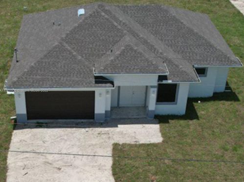 546 Aspen Ave, Lehigh Acres, FL 33974-9613
