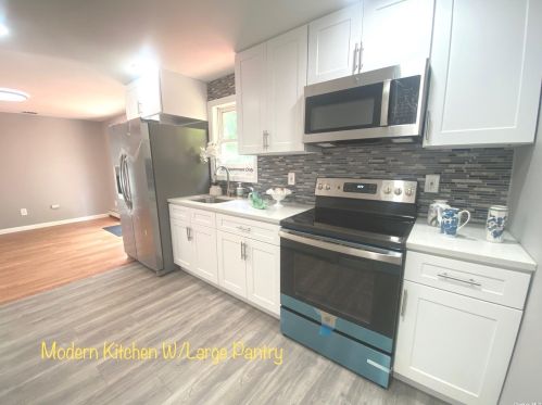 58 Sycamore St, Central Islip, NY 11722-4242